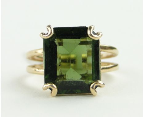 A green tourmaline set ring,
unmarked gold settings, size K.