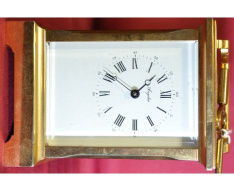 A brass cased carriage clock with key,
clock height 5.25".