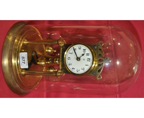 A brass 400-day clock under glass dome,
height 12".