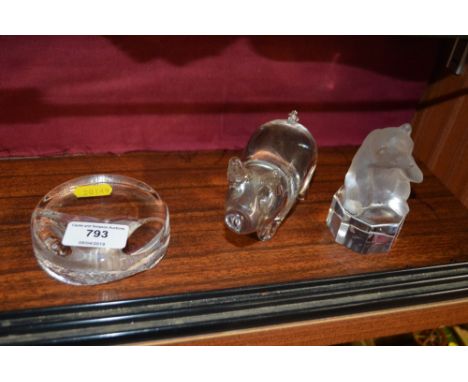 A Swedish glass paperweight depicting a bird; together with a Goebel clear glass model of a bear; and a clear glass paperweig