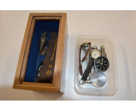 Two boxes containing a Japanese compass; two toffee hammers; a pen knife; button polisher etc. 