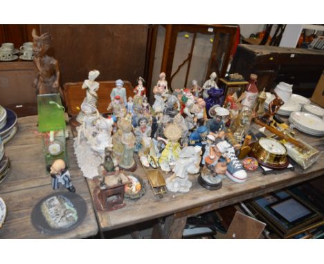 A collection of various decorative figures; a mantel clock; a miniature warming pan etc.