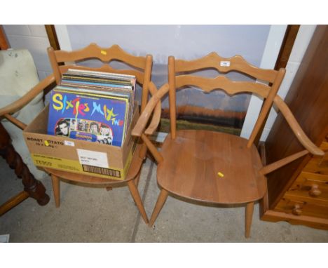 A pair of Ercol light elm elbow chairs