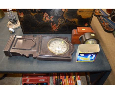 Three various clocks and a box of clock parts