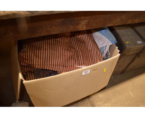 A large box of fabric, curtains etc.