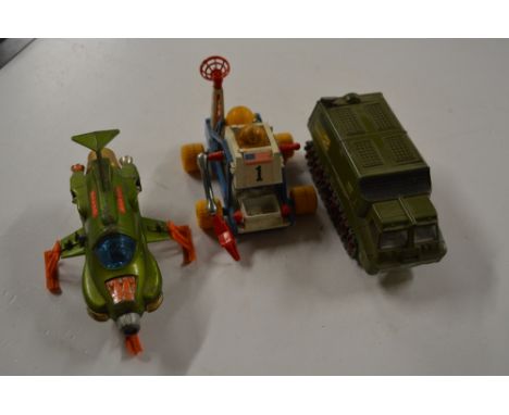 A Dinky toy UFO interceptor; a Corgi Toys James Bond Diamonds Are Forever moon buggy; and a Dinky Toy Shado 2