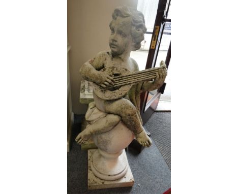 A concrete composite figure of a seated cherub playing a lute raised on a base.  Please note this is very heavy, height 152 c