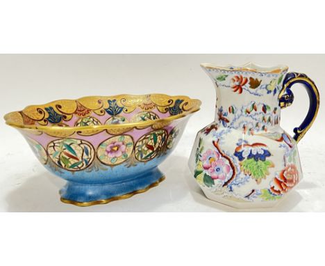 A Royal Doulton Art Deco planter or footed dish decorated with gilt roundels of stylised floral motifs against a mottled blue