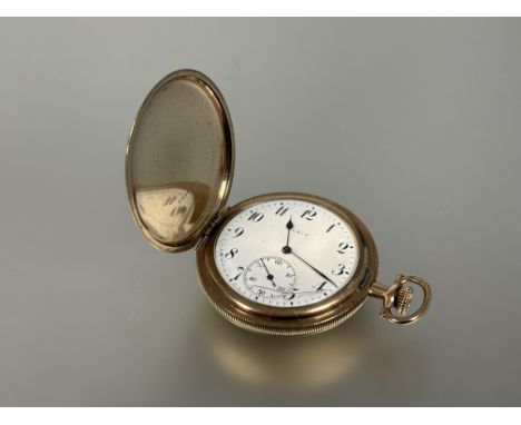 A gents gold plated Elgin USA full hunter pocket watch with white enamel dial and arabic numerals and subsiduaries with engin