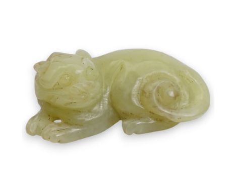 Small Chinese carved jade model of a tiger, modelled in a crouching position, 4.3cm long