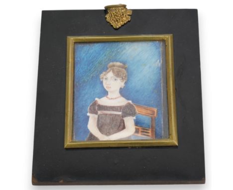 English School (Early 19th century): Portrait of 'Jane Duggleby (1809-1898) aged 12' seated and wearing an empire waist gown,