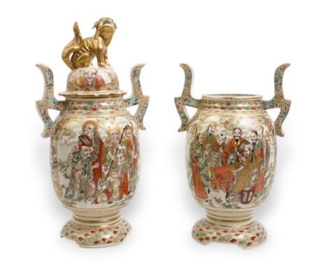 Pair of early 20th century Japanese Satsuma vases, of twin-handled form, one with temple lion finial cover, painted with immo