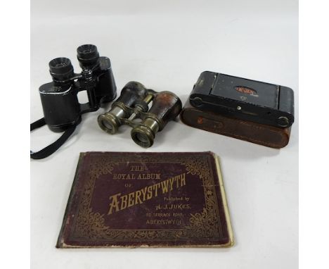 A pair of binoculars from the Jockey Club, together with a modern pair, a camera and an album of postcards