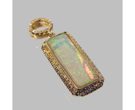 An 18 carat gold opal and diamond pendant, 3cm overall, on chain