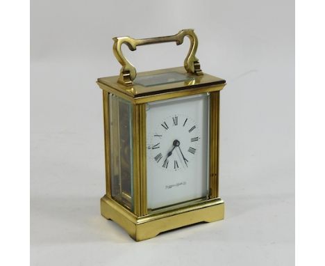 A brass cased carriage clock, by Mappin and Webb, 15cm high