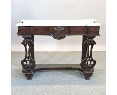 A Victorian carved mahogany marble top console table, 112cm
