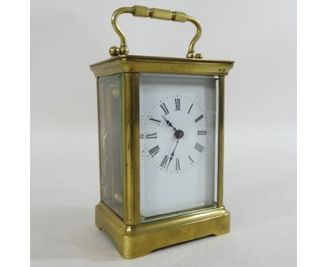 An Edwardian brass cased carriage clock, inscribed 1906, 15cm high overall