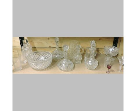 A shelf of cut glass, to include decanters