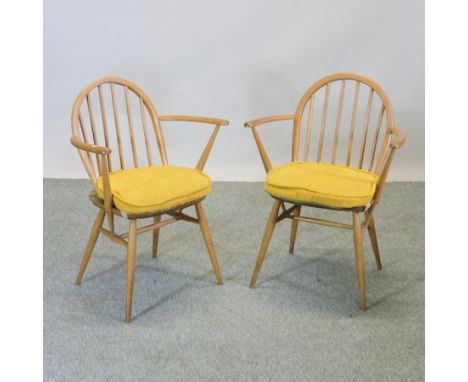 A pair of Ercol light elm open armchairs