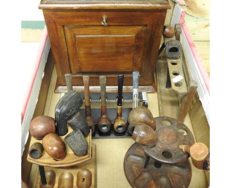 A tabletop smoker's cabinet, a collection of pipes and pipe racks, together with a spirally turned ashtray