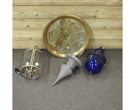 A brass hall lantern, together with a blue glass lantern, a large metal finial, 56cm high overall and a circular brass tray