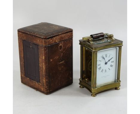 A 19th century brass cased carriage clock, by Elkington, Paris, with travelling case, 15cm high overall
