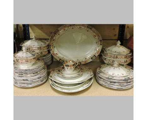 A shelf of Staffordshire dinner wares, to include meat plates and tureens