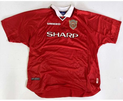 An Umbro made Manchester United football shirt (XXL) with 'Only Football' 'Only United' patch/tag bearing a signature by Tedd