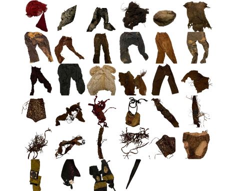 A collection of customers and props from the TV series Xena: Warrior Princess. including a hat and set banners from the final
