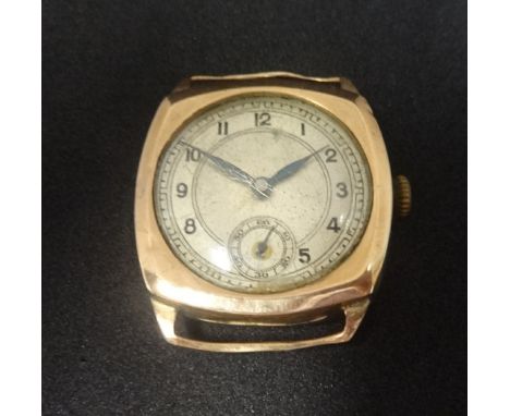 A 9ct gold vintage gents watch with arabic numerals and sub-second dial, lacks bracelet.