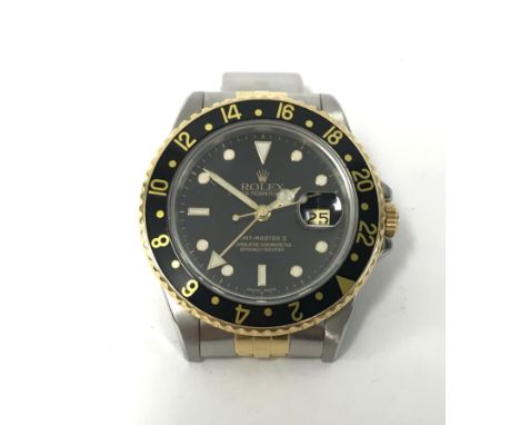 Rolex, GMT Master II, a fine gents stainless steel and gold wristwatch with box, outer box and papers, with a service date of