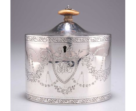 A GEORGE III SILVER TEA CADDY X by Henry Chawner, London 1788, oval, engraved with floral swags, pendant flowers, initials an