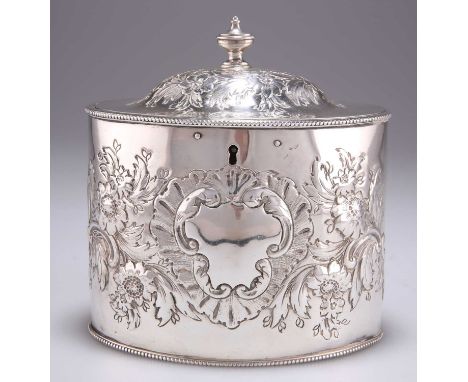 A GEORGE III SILVER TEA CADDY overstruck with maker's mark I.B, London 1786, oval with hinged domed cover, later chased with 