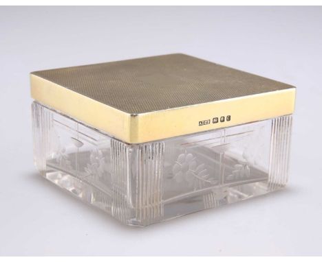 A GEORGE VI SILVER-GILT TOPPED AND CUT-GLASS BOX maker ADLD, London 1938, square, the pull-off cover with engine turning and 