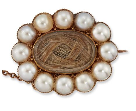 A MID 19TH CENTURY SPLIT PEARL AND HAIRWORK MOURNING BROOCH a knotted hairwork panel within a border of split pearls, engrave