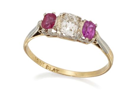 AN EARLY 20TH CENTURY DIAMOND AND RUBY THREE STONE RING an old cushion-cut diamond spaced by cushion-cut rubies, to knife-edg