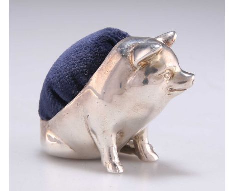 AN ELIZABETH II LARGE SILVER NOVELTY PIN-CUSHION maker E F, Sheffield 2000, cast in the form of a pig on its haunches. 5cm hi