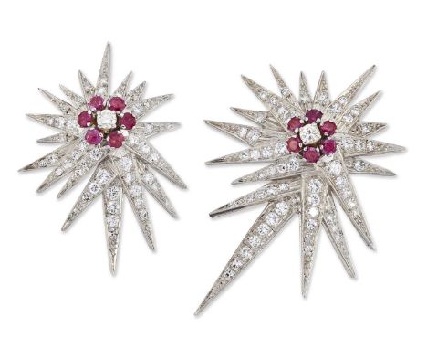 A GRADUATED PAIR OF RUBY AND DIAMOND STAR BROOCHES each with round brilliant-cut diamonds within borders of round-cut rubies 