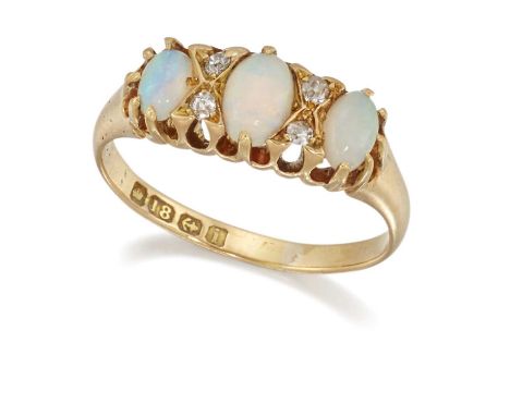 AN EDWARDIAN 18 CARAT GOLD OPAL AND DIAMOND RING three oval opals spaced by pairs of eight-cut diamonds. Hallmarked Birmingha