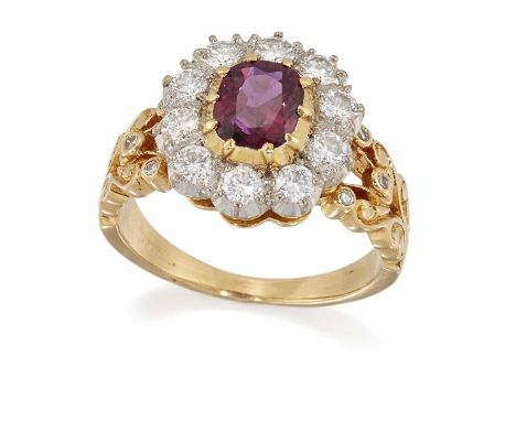 A RUBY AND DIAMOND CLUSTER RING  a cushion-cut ruby within a border of round brilliant-cut diamonds, to fancy diamond-set scr
