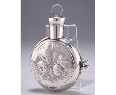 A LATE VICTORIAN SILVER CASED SCENT BOTTLE by William Comyns &amp; Sons, London 1898, the hinged case chased with cherub head