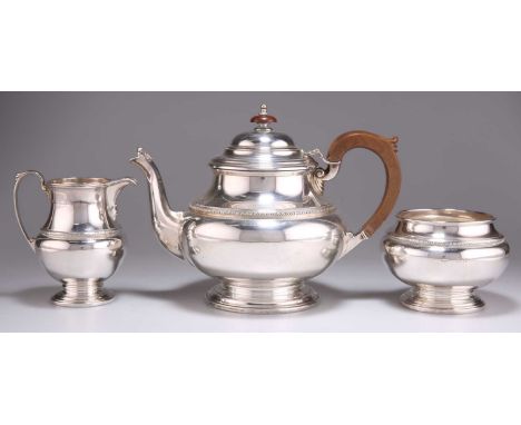 A GEORGE V SILVER THREE-PIECE TEA SERVICE by Mappin &amp; Webb Ltd, Birmingham 1930, comprising teapot, sugar and cream, pear