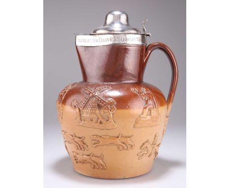 A GEORGE III SILVER-MOUNTED STONEWARE CIDER JUG maker IT, London 1792, the bulbous body with the sprigged decoration of hunti