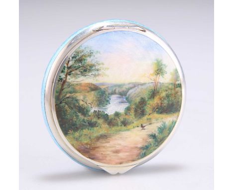 AN EARLY 20TH CENTURY SILVER AND ENAMEL COMPACT import marks, Cohen &amp; Charles, London 1931, circular, the hinged cover de