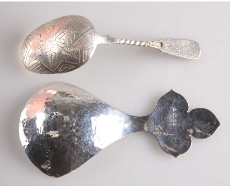 AN ELIZABETH II SILVER CADDY SPOON AND A RUSSIAN SILVER CADDY SPOON the first by Christopher Milton Stevens, London 1979, wit