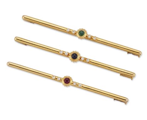 CARTIER - A SET OF THREE BROOCHES round cabochon emerald, sapphire and ruby within beaded borders and spaced by round brillia