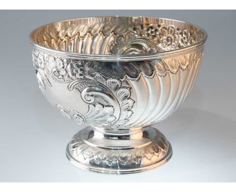 AN EDWARDIAN SILVER BOWL by Cooper Brothers &amp; Sons Ltd, Sheffield 1901, of circular footed form, chased with flowerheads,