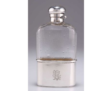 A VICTORIAN SILVER-MOUNTED GLASS HIP-FLASK by W &amp; G Neal, London 1894, with twist hinged cap and detachable cup to the ba