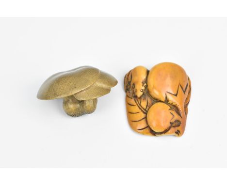A Japanese carved ivory netsuke, 19th century, modelled as a mouse on a leaf with fruit, unsigned, 4cm wide, together with a 