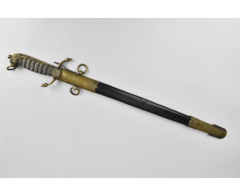 A George V Midshipment's Dirk, with black leather scabbard mounted with brass fittings, the shagreen style and brass hilt wit